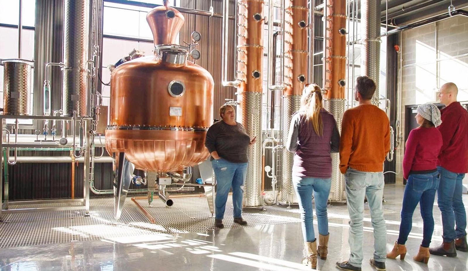 people taking a tour of Paradigm Spirits