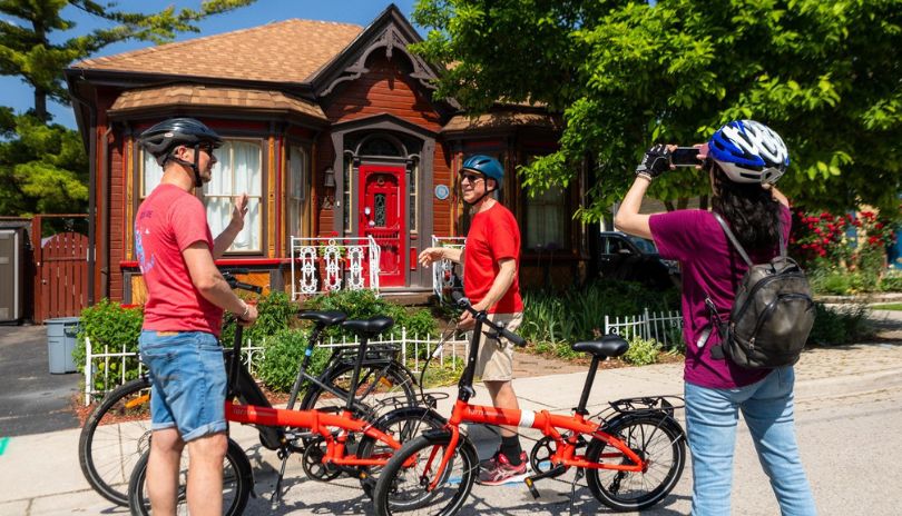 Three cyclist enjoying a sunny day with their bikes.