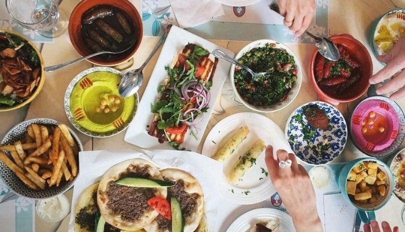 Table filled with Lebanese dishes at Yasmine's Authentic Lebanese Cuisine in London, Ontario.