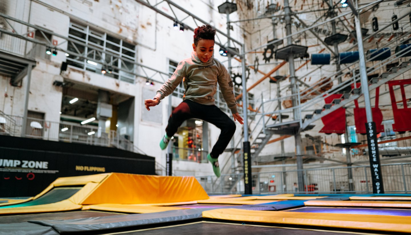 Child playing in trampoline park at The Factory in 100 Kellogg Lane.